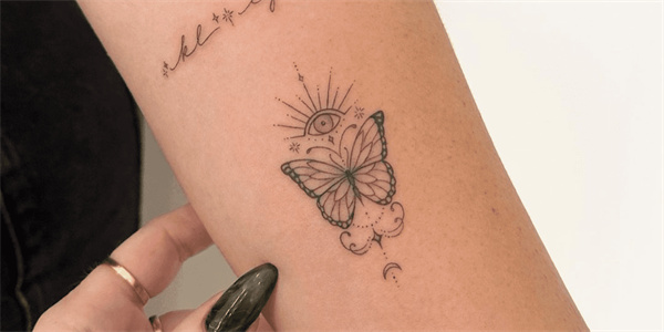 Carnation and butterfly tattoo