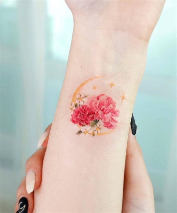 Carnation wrist tattoo